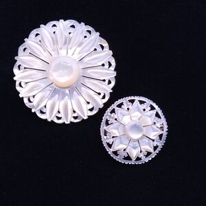 Vintage Bethlehem mother-of-pearl carved floral filigree cutout brooch.